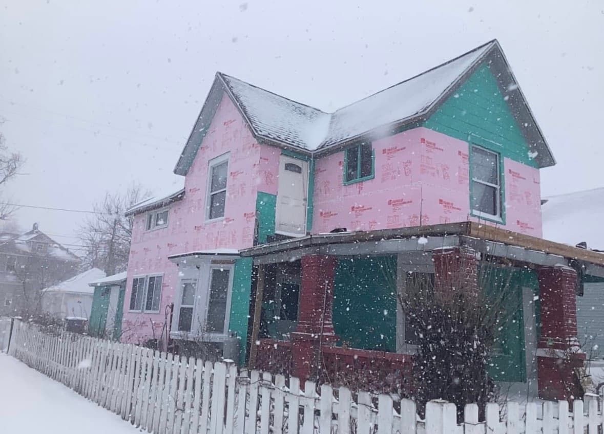 Foam board and house wrap before new siding, winter