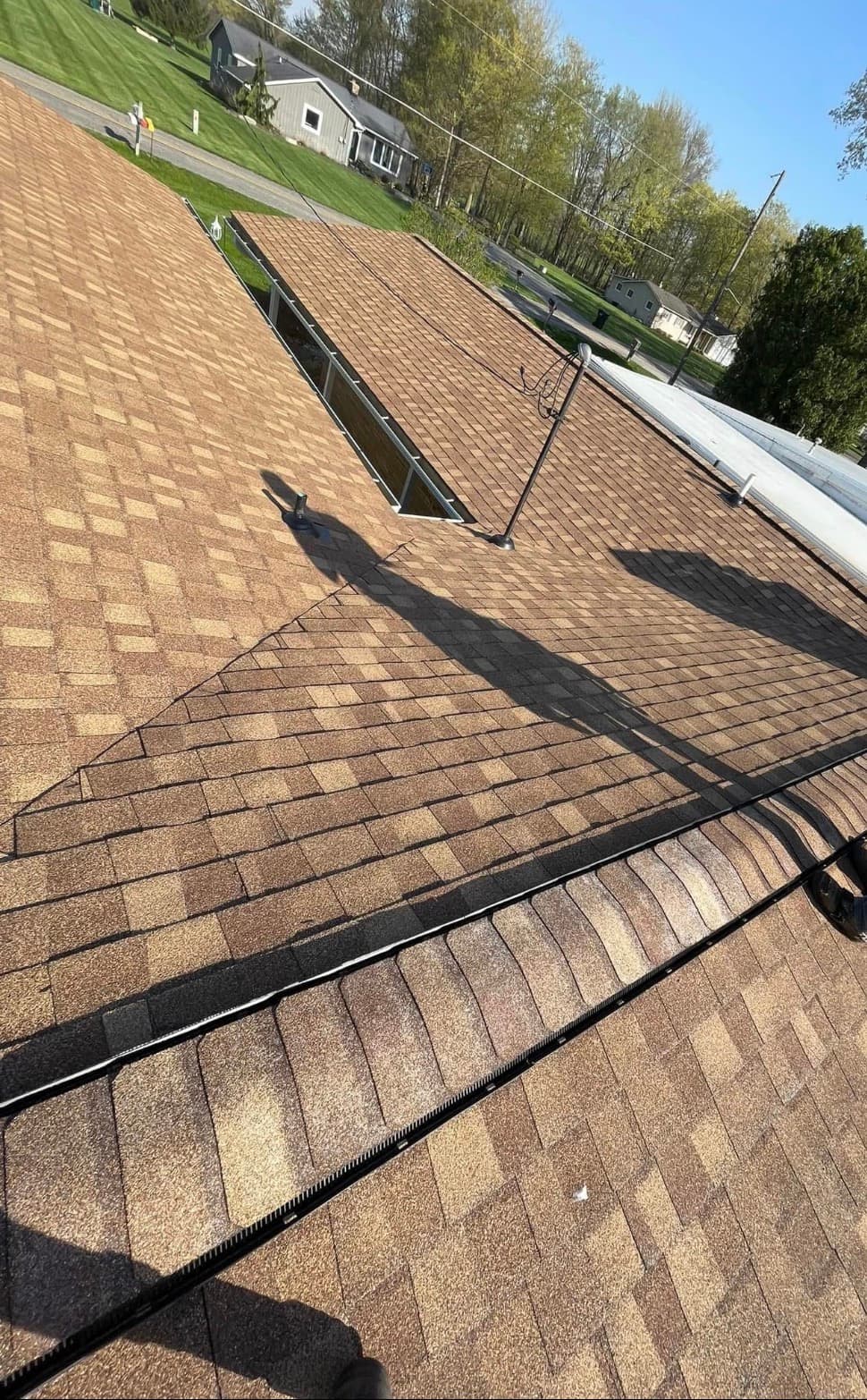 Finished architectural shingles in warm brown