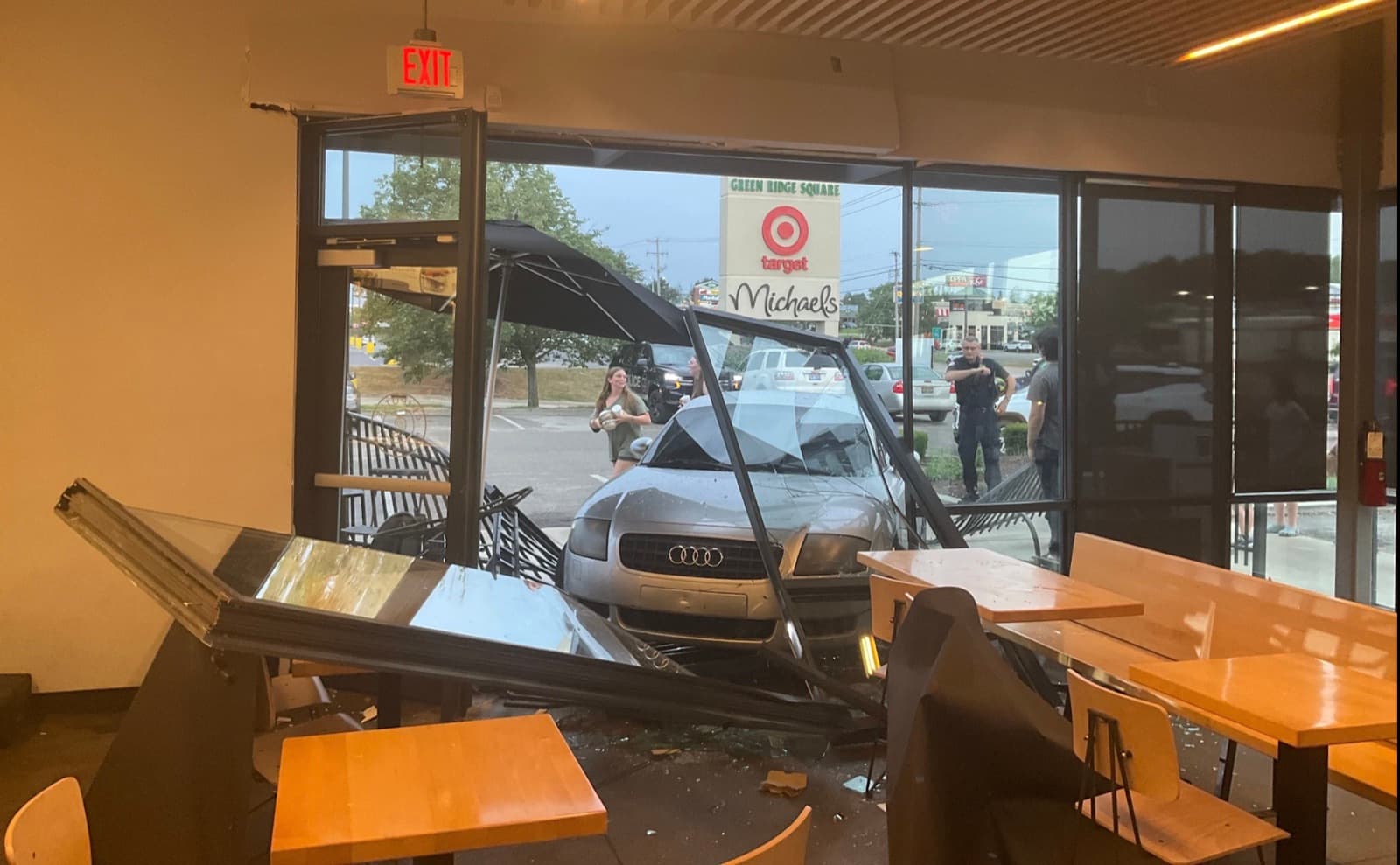 A car crashed through the front of a commercial storefront