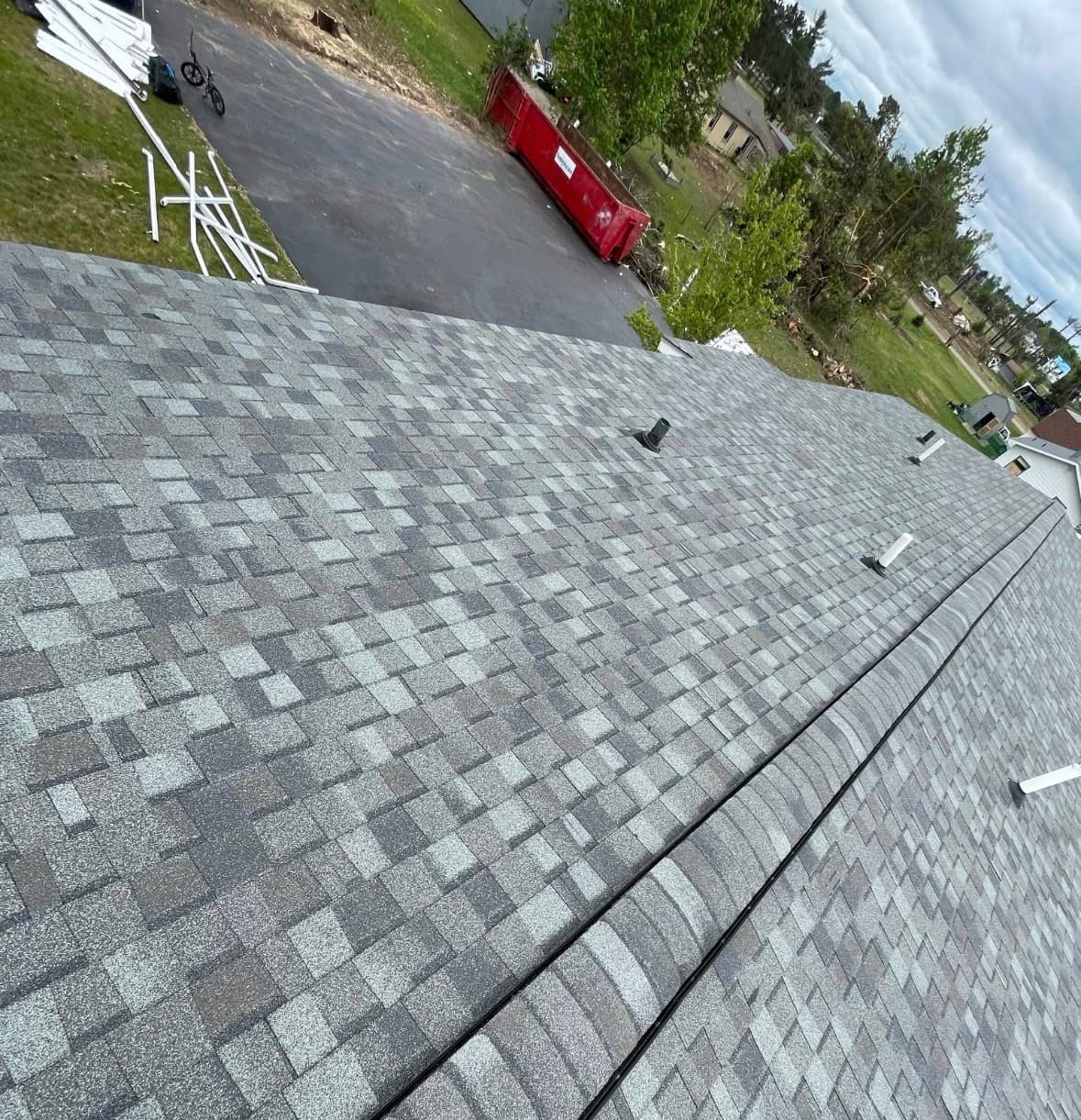 Repaired and finished shingle roof on a West Michigan home