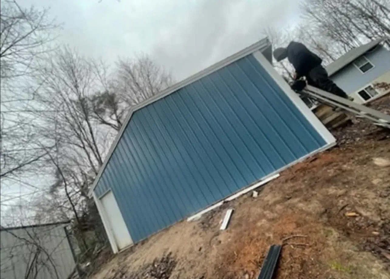 New metal siding back up on the repaired gable